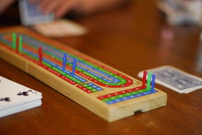 cribbage board and playing cards